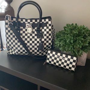 Michael Kors black and white purse and wallet.